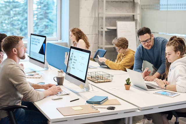 People working around table